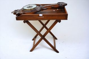 A 19th century Butlers mahogany serving tray on stand. Along with a late 19th century carved wall