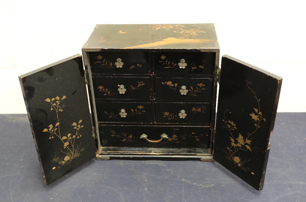 An early 20th Century Chinese black lacquered small table top cabinet, Chinese round wall hanging, - Bild 4 aus 6