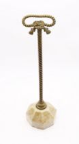 A 19th century brass door porter/stop, with knotted rope designed looped handle and rope twist stem,