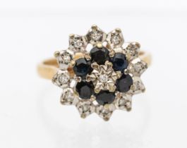 A sapphire and diamond 9ct gold cluster ring, claw set, approx 8mm diameter, size N, total gross