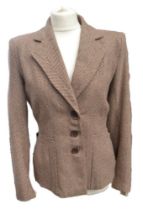 A beige brown check 1940s jacket bearing the CC41 label in the seam (mark used in WW2 on all