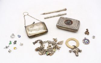 A collection of silver items to include a vintage charm bracelet with various charms some souvenir