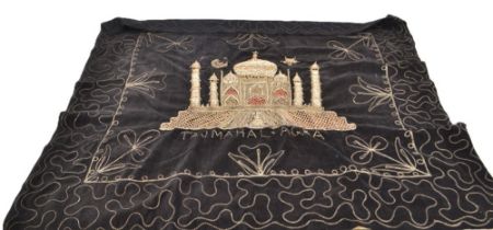 A black cloth depicting the Taj Mahal in rich gold bead encrusted embroidery stitched onto black