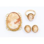 A collection of 9ct gold carved cameo jewellery to include a brooch, within fancy mount, length