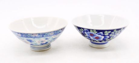 Two Chinese bowls; dark blue floral and light blue floral.