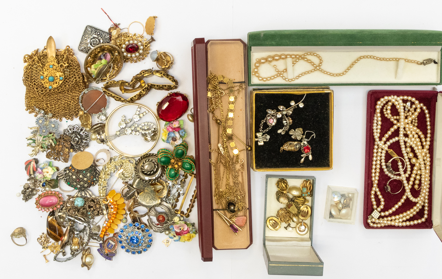 A collection of costume jewellery including paste set brooches, cultured pearl necklace, faux