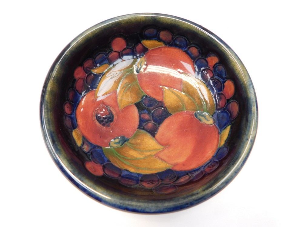 1920's William Moorcroft blue ground bowl in the pomegranate pattern, chip to foot rim - Image 2 of 2