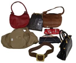 A collection of handbags and a brown embossed wide belt with bronze beadwork. Handbags include a