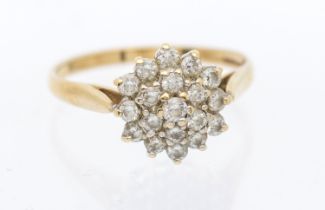 A diamond set cluster 9ct gold ring, circular mount, claw set with small round brilliant cut