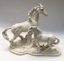 A large resin table figure group of wild horses, several cracks to body of piece.