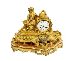 A 19th century gilt metal ornate mantel clock, having figural top leaning against clock face,