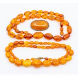 A collection of amber jewellery to include a butterscotch necklace, comprising graduated oval beads,