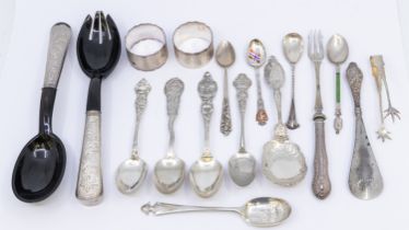 A collection of mixed silver flat wares to include; a novelty teaspoon with Lord Nelson shaped