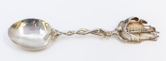 An early 20th century Hanau silver spoon, of elaborate form with twisted stem leading to a figure