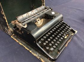 An early 20th Century Olympia cased black typewriter.