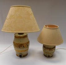 Stoneware whiskey and rum barrels converted into lamps.