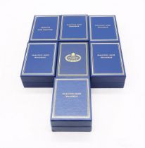 A collection of seven boxed Halcyon Days enamelled boxes to include; Just to say I love you, A