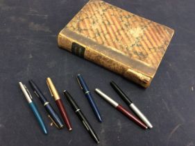 A small collection of 20th century pens to include; a Parker 1/5 12ct rolled gold cased fountain pen