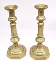 Pair of tall heavy worked early 19th Century candlesticks, 33cm high