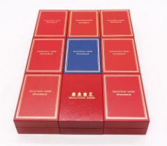 A collection of nine boxed Halcyon Days enamelled boxes to include; Christmas 1998, 2002, 2004,