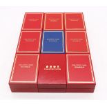A collection of nine boxed Halcyon Days enamelled boxes to include; Christmas 1998, 2002, 2004,