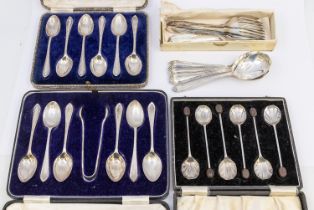 A collection of cased silver spoon sets to include; a George VI cased set of six teaspoons and sugar