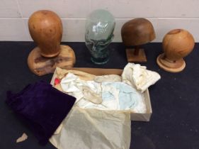 A collection of head blocks in wood (3), one mushroom shape on a stand and one green glass . (4).