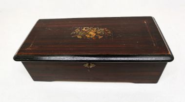 A late 19th Century Swiss musical box which plays ten tunes in mahogany inlayed box by P.V.F, all