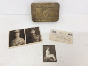 A WW1 1914 Princess Mary Christmas tin with partial contents and Christmas card. Contents include