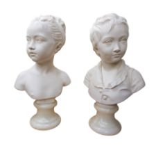 A pair of late 19th century alabaster busts of young children, one a boy wearing a cardigan and