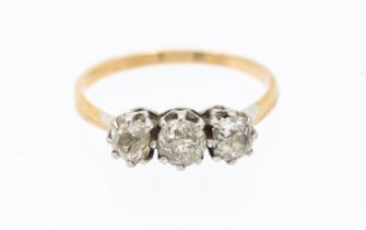 A three-stone diamond and 18ct gold ring, comprising three graduated old cut diamonds, total diamond