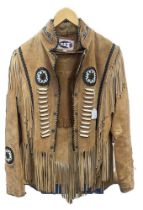 A mens North American native western beige jacket decorated with tribal beadwork, two large badges