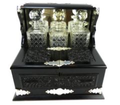 Victorian silver mounted ebonised tantalus games compendium with three decanters. Sheffield 1893.