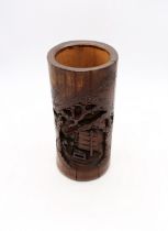 An early 20th Century Chinese bamboo carved brush pot with boating scene.