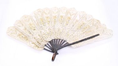 An early 20th century probably 1920s fan, having horn staithes and handle and hide/vellum fans, gilt