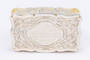 A Victorian silver snuff box, of shaped rectangular form with engraved foliage design, gilt