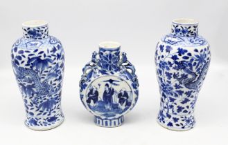 A pair of Chinese blue and white porcelain vases, no covers, decorated with floral, foliage and