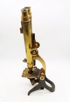 A fine 19th Century binocular brass microscope in good condition in mahogany case, great for