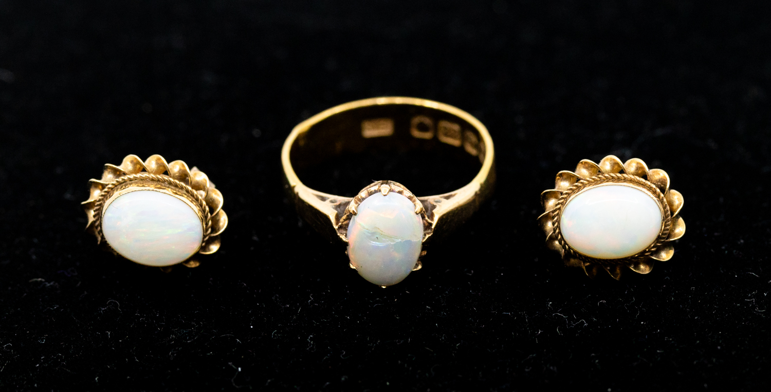 A pearl set 22ct gold single stone ring, set with oval cabochon opal (cracked) width approx 7mm,