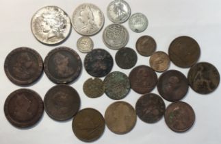 A collection of British & World coins to include silver 1923 US Peace Dollar, Victorian 1889