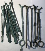 Collection of Bronze and Copper tools and bird topped priest rings all in a Roman style.