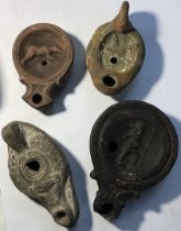 Oil lamps in the style of ancient Roman and Egyptian oil lamps.