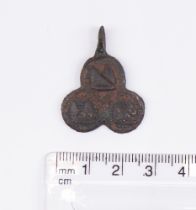 Medieval Heraldic Mount. Copper-alloy. H23.7mm. W24.8mm. 9.07g . The pendant is trefoil in shape
