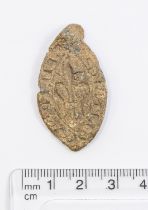 Medieval lead vesica seal featuring a Fluer-de-lis decoration on the front. Inscription is