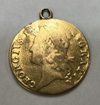 George II, 1734 Guinea. Mount attached to edge & in thin poor condition. Approximately 6.65g.