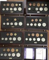 A set of British coins WWII issued by DanburyMint in a wooden 8 drawer chest. With Certificates in