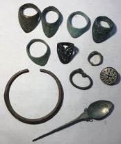 Collection of collared archer’s rings with other metal objects.