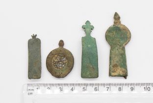 Bulk lot of three medieval copper alloy strap ends and a spacer.                       Strap end 1