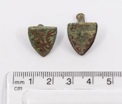 A pair of copper-alloy Heraldic shield-shaped stud mounts of Medieval date (AD1200-1400).The