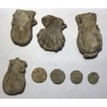 Four Medieval Pilgrims Ampulla and Tokens .  Circa 14th-15th century AD. Lead. The Ampullae were '